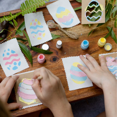 girls painting easter egg bunting